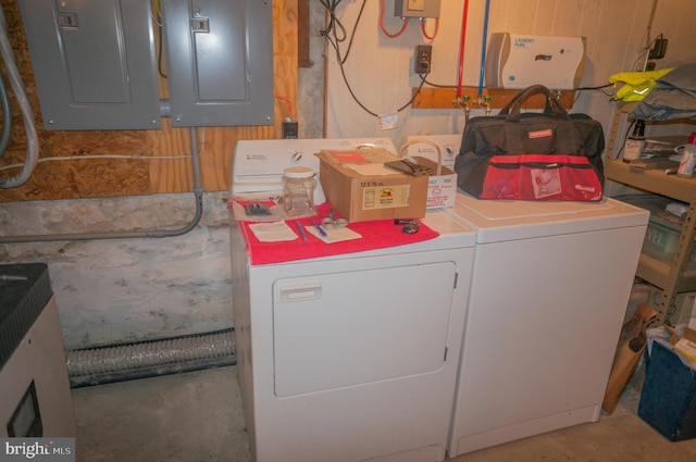 washroom featuring washer and dryer and electric panel