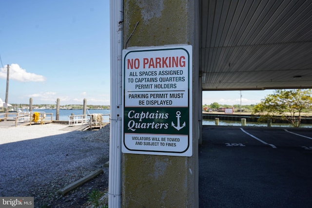 community sign with a water view