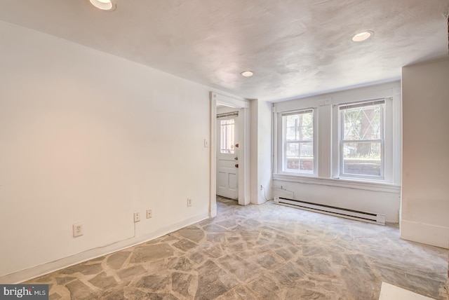 spare room featuring a baseboard radiator