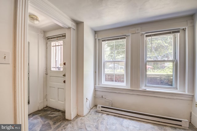 foyer with a baseboard heating unit