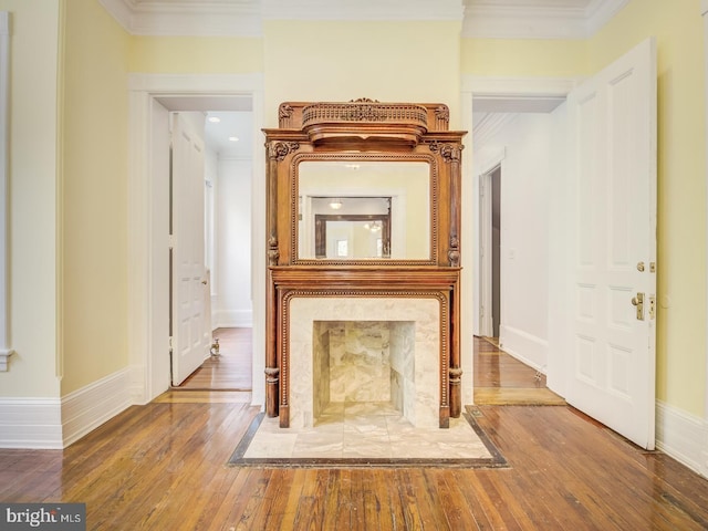 corridor with crown molding and wood-type flooring