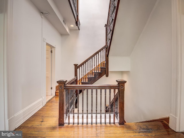 stairs with wood-type flooring