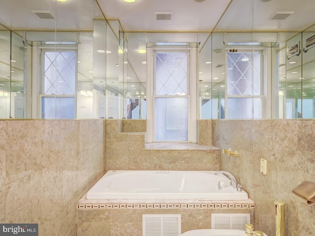 bathroom with tiled tub