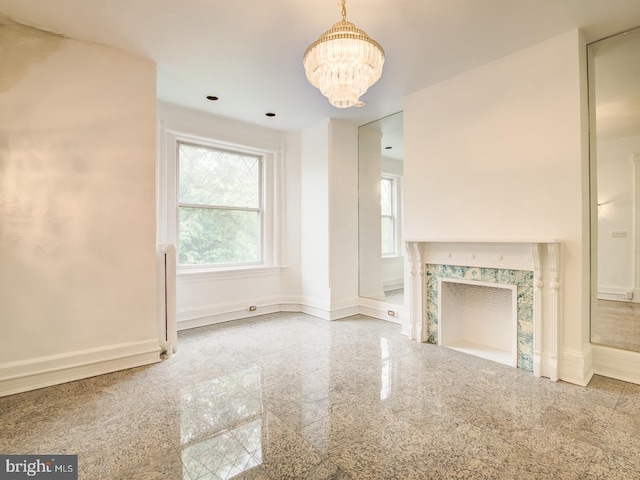 unfurnished living room with a chandelier