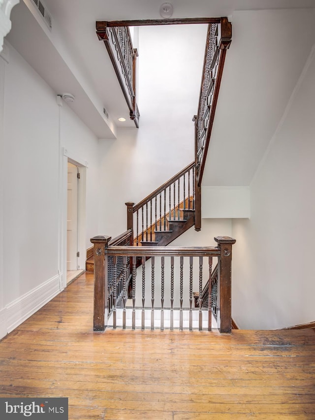 stairway featuring hardwood / wood-style floors