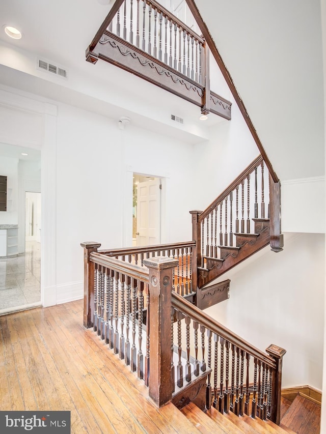 stairway featuring wood-type flooring