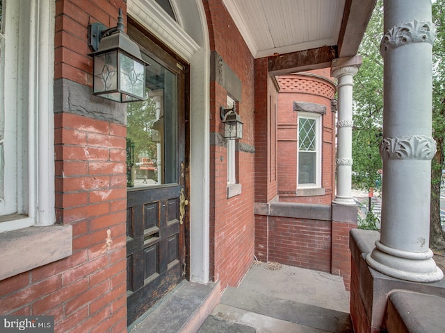 entrance to property featuring a porch