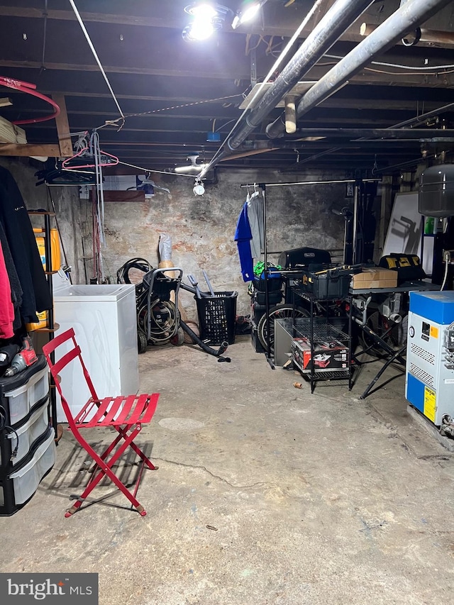 unfinished basement featuring washer / clothes dryer