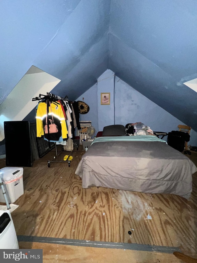 bedroom with lofted ceiling