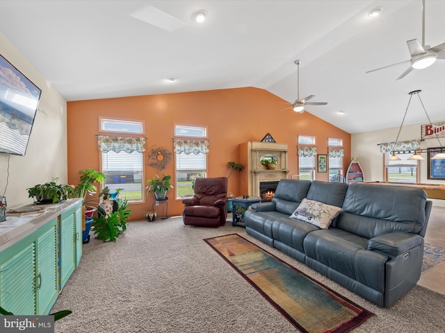 carpeted living room featuring ceiling fan and lofted ceiling