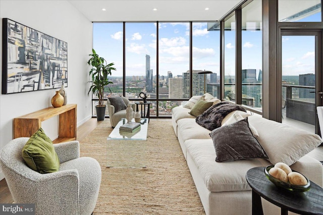 living room with hardwood / wood-style floors and expansive windows