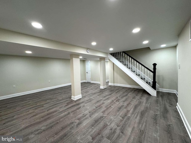 basement with dark wood-type flooring