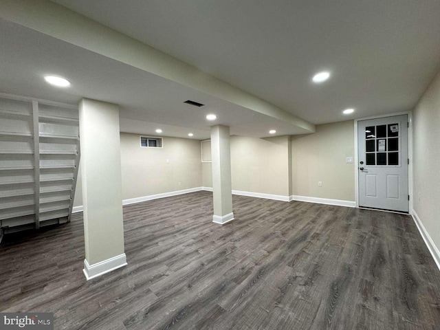 basement with dark wood-type flooring