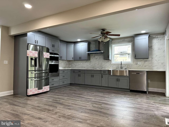 kitchen featuring light hardwood / wood-style flooring, sink, and stainless steel appliances