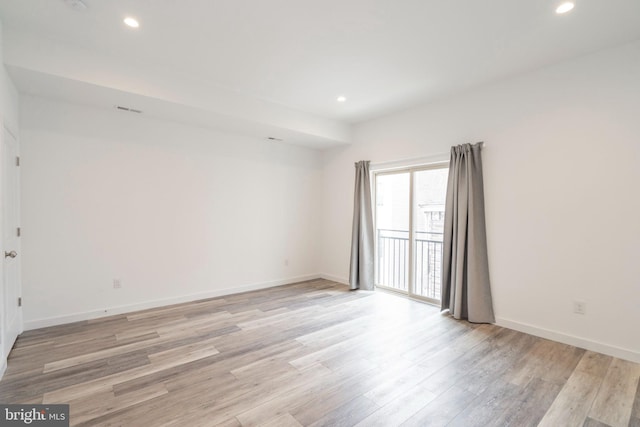 unfurnished room featuring light hardwood / wood-style flooring