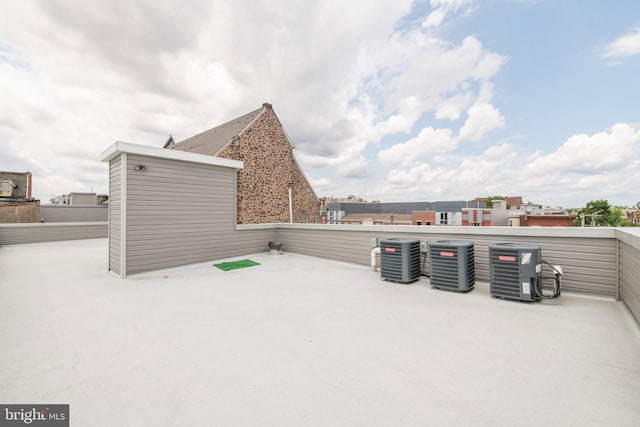 view of terrace with a balcony and central air condition unit