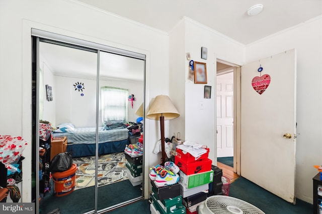 bedroom featuring ornamental molding and a closet