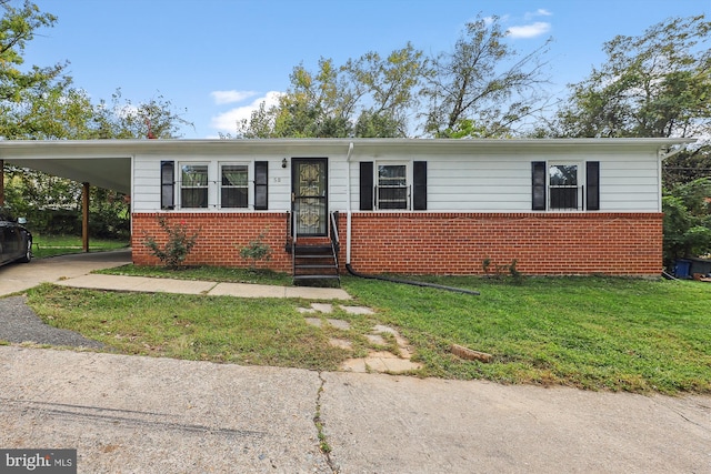 view of front facade with a carport and a front lawn