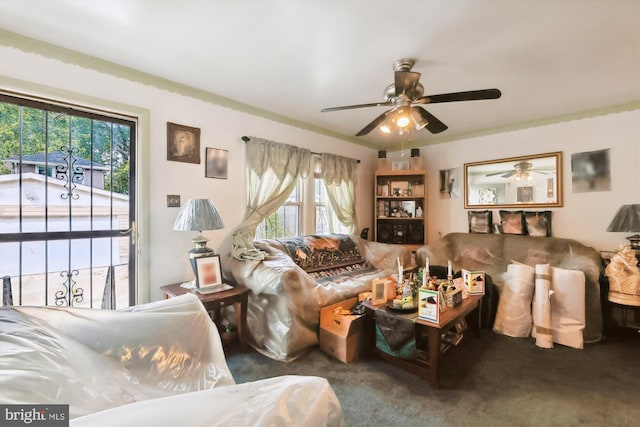 living room with ceiling fan and carpet flooring