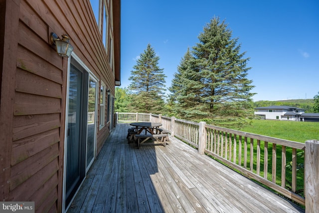 deck featuring a lawn