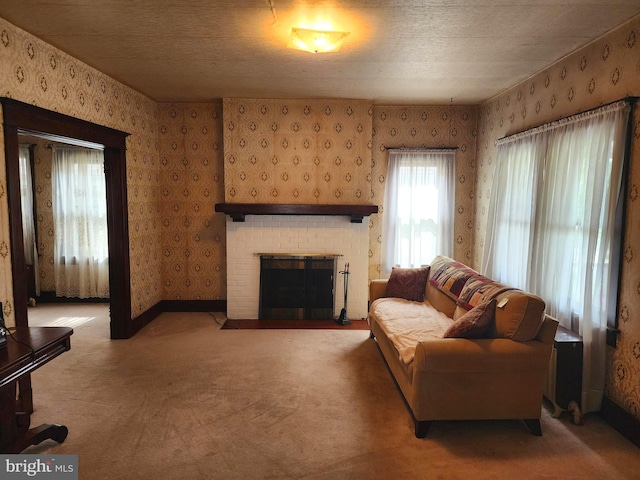 carpeted living room with a textured ceiling and a brick fireplace