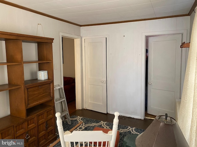 interior space with ornamental molding and dark hardwood / wood-style flooring