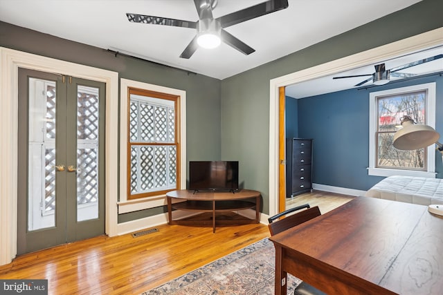 office featuring french doors and light wood-type flooring