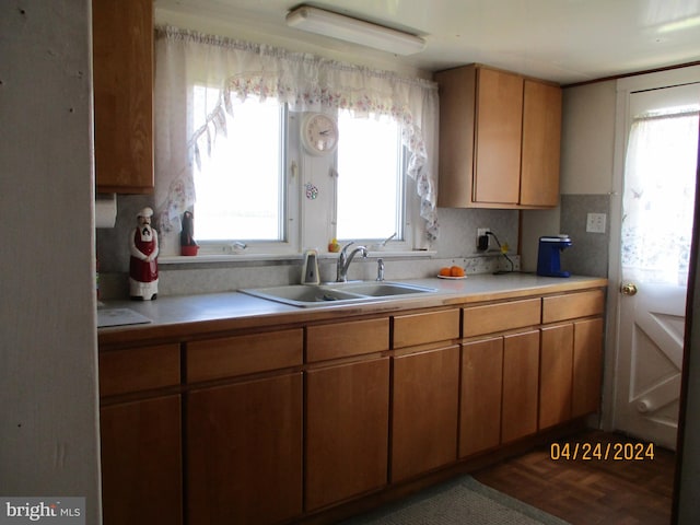 kitchen featuring sink and tasteful backsplash