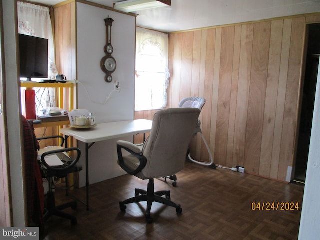 office area featuring wooden walls and dark parquet floors