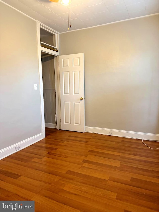 interior space with hardwood / wood-style flooring and a closet