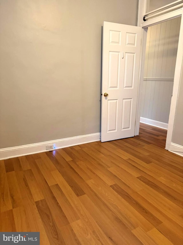 empty room featuring wood-type flooring