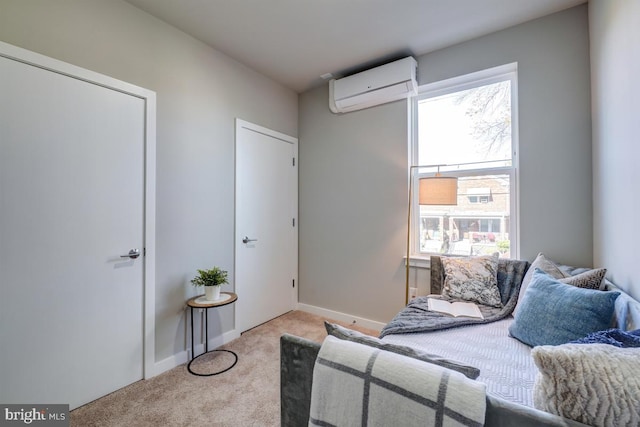 bedroom with light carpet and a wall mounted air conditioner