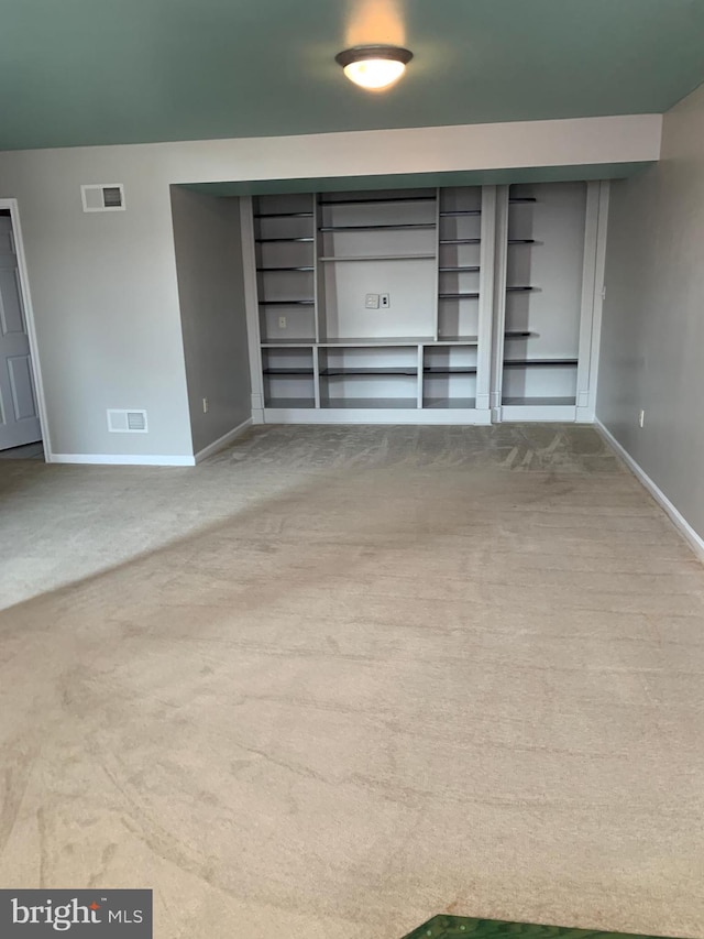 unfurnished living room with carpet