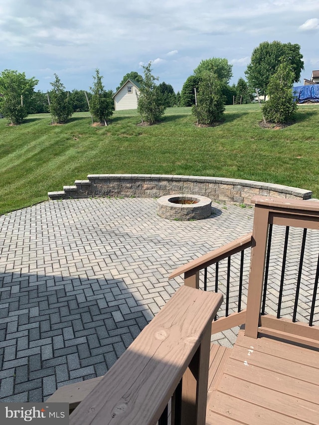 view of patio featuring a fire pit