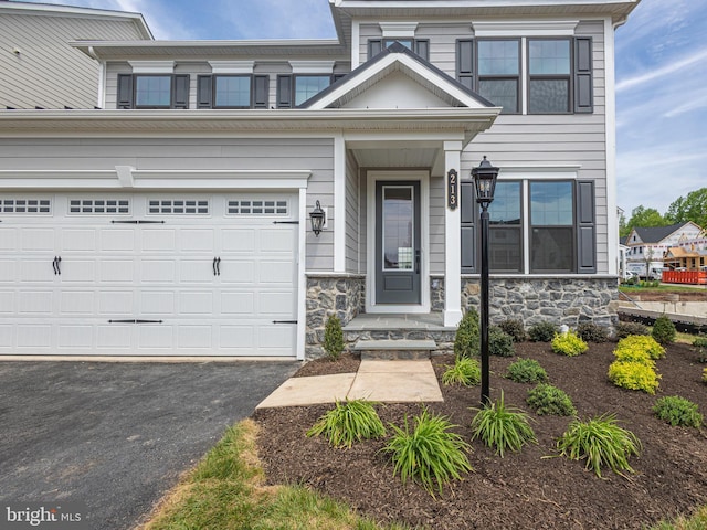 view of front of home with a garage