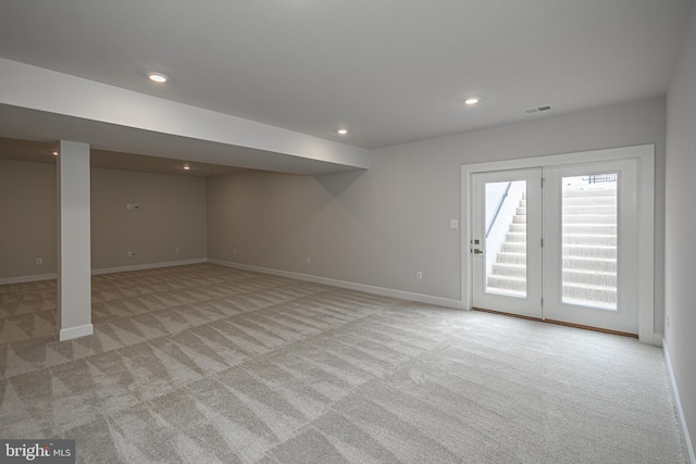 basement with light colored carpet