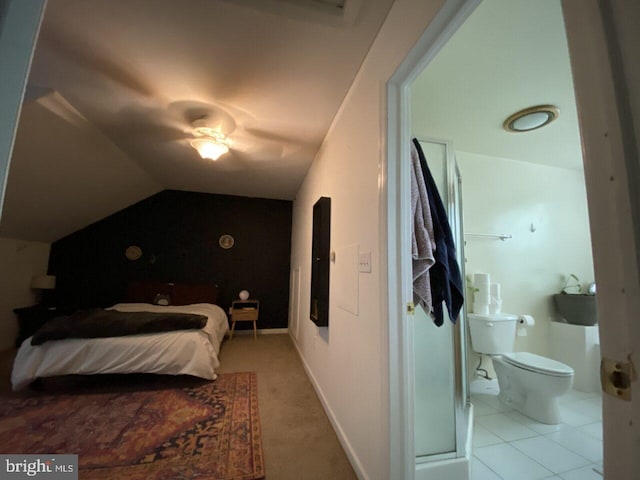 bedroom featuring connected bathroom, ceiling fan, and lofted ceiling