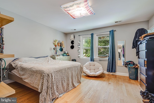 bedroom with light wood-type flooring