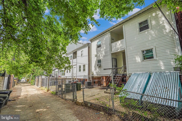 exterior space with a balcony and central air condition unit