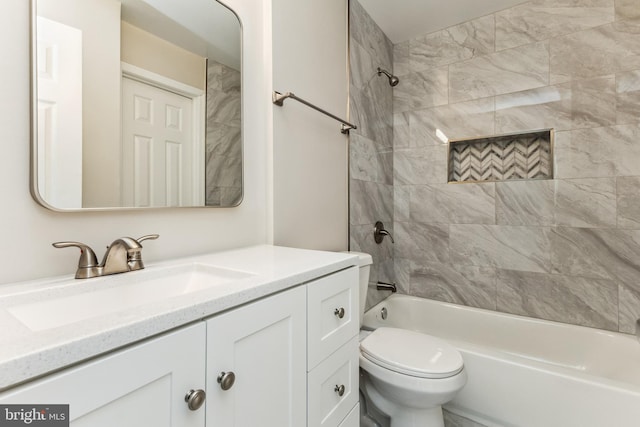 full bathroom with tiled shower / bath combo, toilet, and vanity