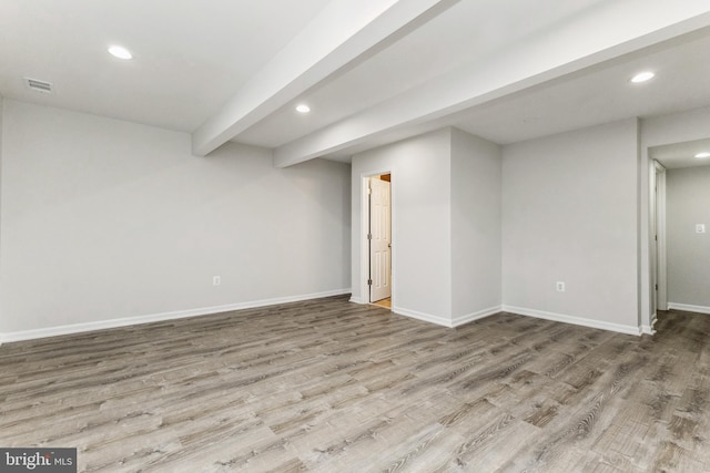 basement with hardwood / wood-style floors