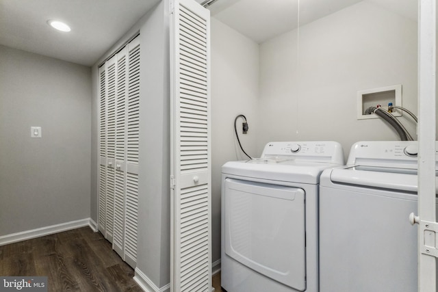 laundry area with washer hookup, hookup for an electric dryer, dark hardwood / wood-style floors, and washer and dryer