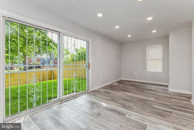 unfurnished room featuring light hardwood / wood-style flooring