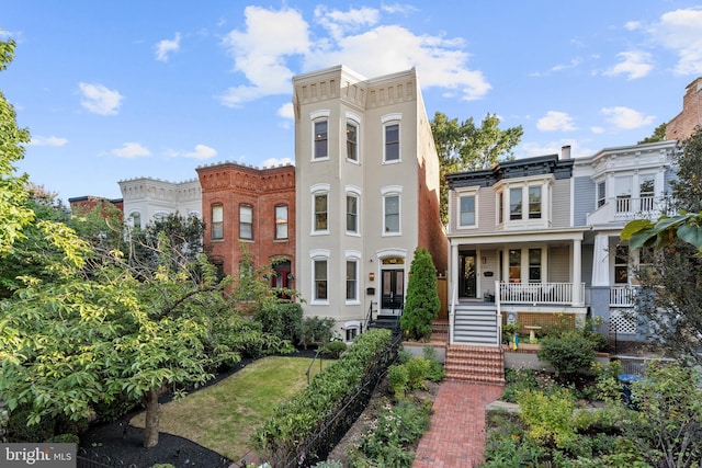 view of property featuring a porch