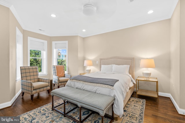 bedroom with dark hardwood / wood-style flooring and ornamental molding