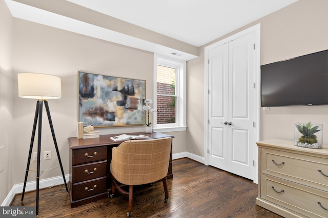 home office with dark wood-type flooring