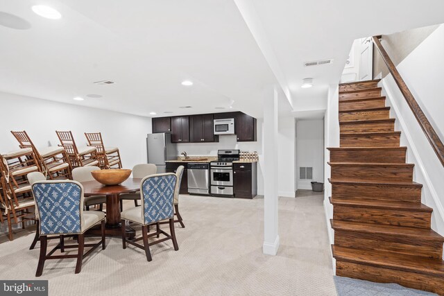 view of carpeted dining space