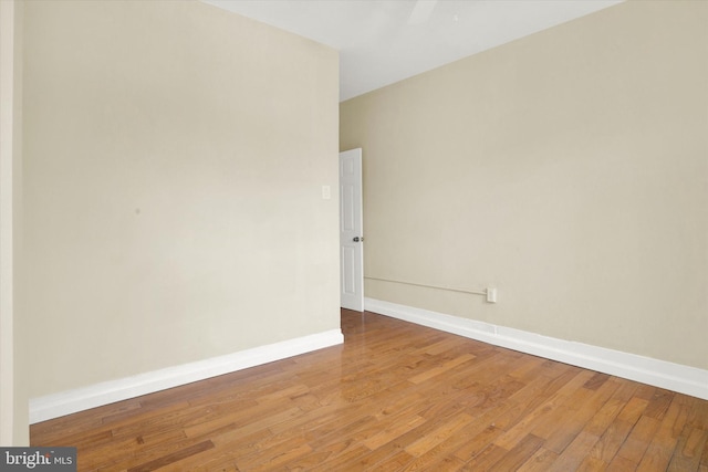 empty room with hardwood / wood-style floors