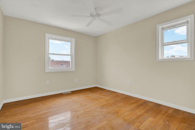 unfurnished room with light hardwood / wood-style floors and ceiling fan