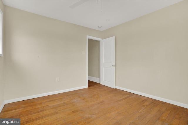 unfurnished room with ceiling fan and light wood-type flooring